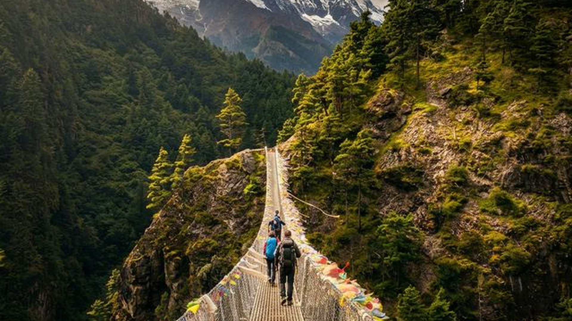 Crossing suspension bridge in Khumbu valley